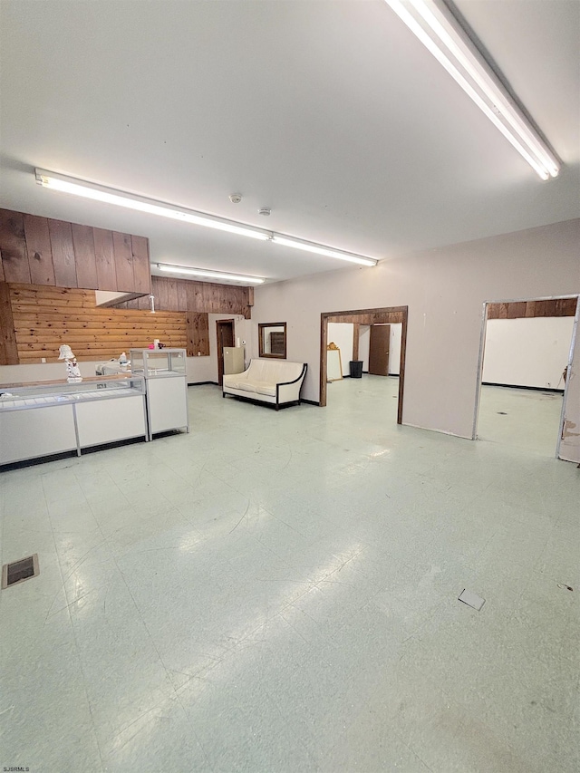 garage featuring wood walls