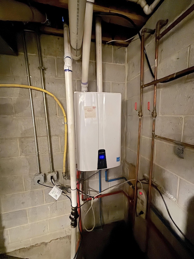 utility room featuring water heater