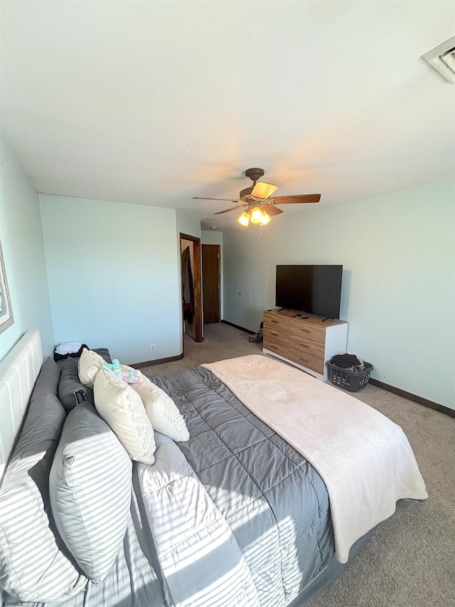 bedroom with carpet, a ceiling fan, and baseboards