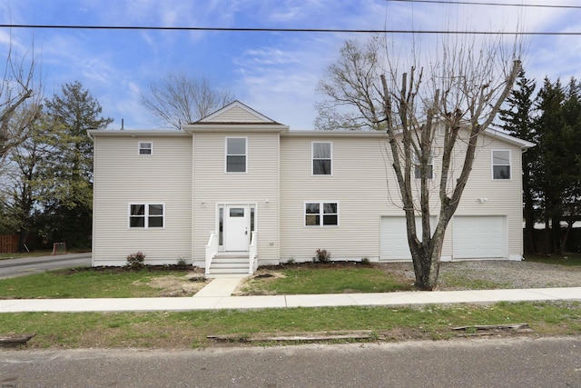 view of front of property featuring a garage and driveway