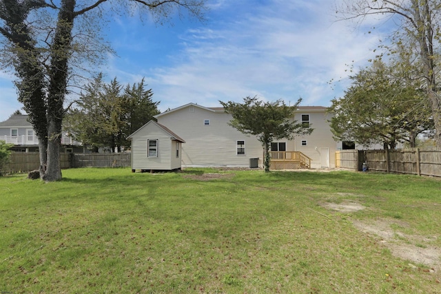 rear view of house with a wooden deck