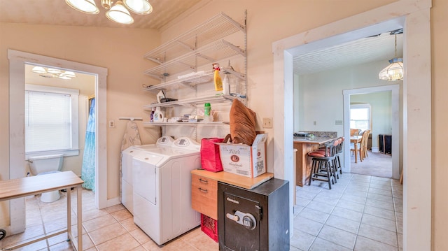 919 Broad St, Pleasantville, NJ 08232 - clothes washing area with washing machine and dryer, a chandelier, and light tile patterned floors