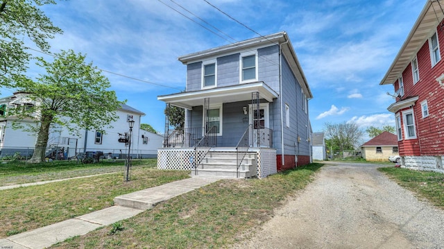 919 Broad St, Pleasantville, NJ 08232 - traditional style home featuring a porch, dirt driveway, and a front lawn