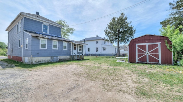 919 Broad St, Pleasantville, NJ 08232 - rear view of property with an outdoor structure and a storage unit