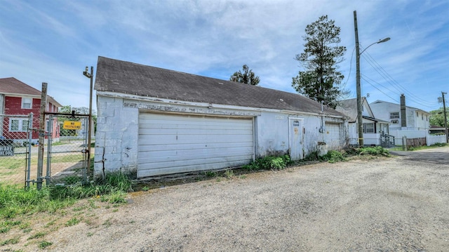 919 Broad St, Pleasantville, NJ 08232 - detached garage featuring a gate and fence