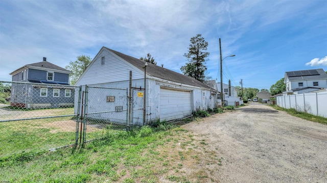 919 Broad St, Pleasantville, NJ 08232 - detached garage featuring fence and a residential view