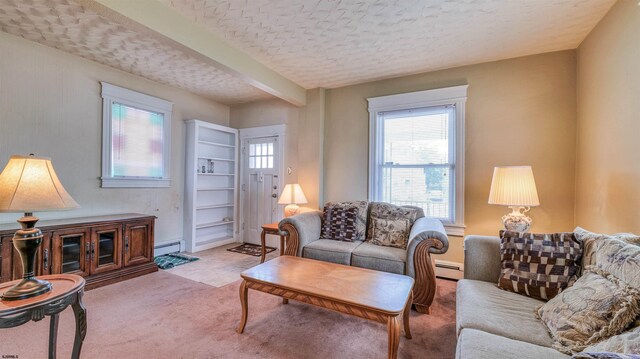919 Broad St, Pleasantville, NJ 08232 - carpeted living area featuring a baseboard heating unit, a textured ceiling, and beamed ceiling