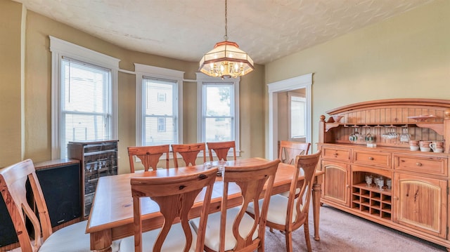 919 Broad St, Pleasantville, NJ 08232 - dining space with a chandelier and light carpet