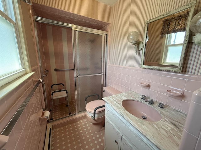 8508 Wellington Ave, Margate, NJ 08402 - bathroom with tile walls, vanity, toilet, a shower stall, and wainscoting