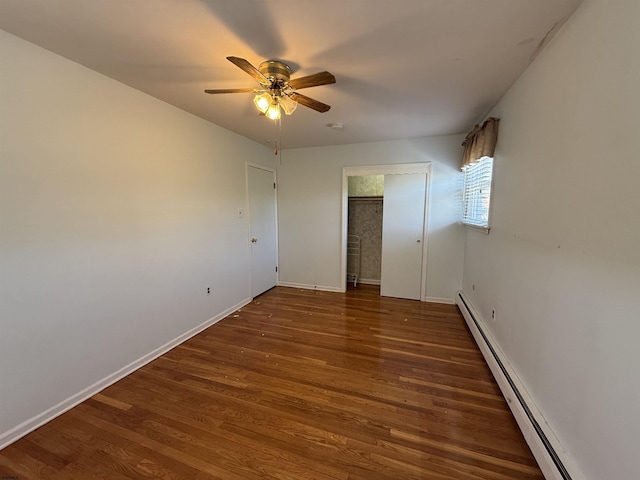 8508 Wellington Ave, Margate, NJ 08402 - unfurnished bedroom featuring a baseboard radiator, wood finished floors, baseboards, and ceiling fan