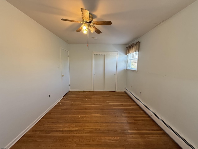 8508 Wellington Ave, Margate, NJ 08402 - unfurnished bedroom featuring baseboard heating, wood finished floors, baseboards, a closet, and ceiling fan