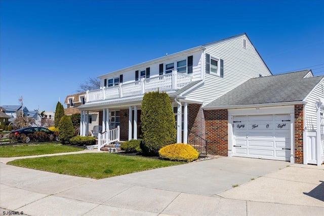 8508 Wellington Ave, Margate, NJ 08402 - traditional home with a balcony, a garage, driveway, brick siding, and a front lawn