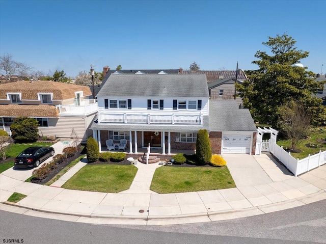8508 Wellington Ave, Margate, NJ 08402 - view of front facade featuring a balcony, a porch, concrete driveway, brick siding, and roof with shingles