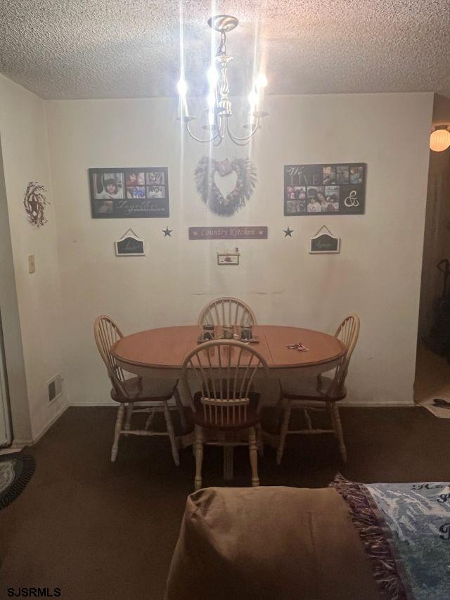 27 Sussex Pl Unit 27, Galloway Township, NJ 08205 - dining room featuring a textured ceiling and carpet flooring