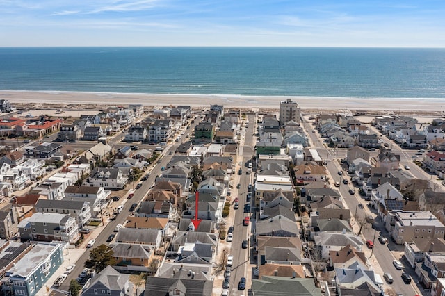 aerial view of residential area with expansive coastline