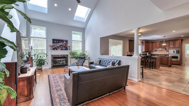 54 Hartford Dr, Egg Harbor Township, NJ 08234 - living room featuring plenty of natural light, high vaulted ceiling, a fireplace, recessed lighting, and ornate columns