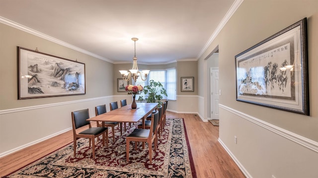 54 Hartford Dr, Egg Harbor Township, NJ 08234 - dining space with light wood-type flooring, a chandelier, crown molding, and baseboards