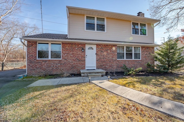 464 S Ash Ave, Galloway Township, NJ 08205 - view of front of house featuring a chimney, brick siding, and a front yard
