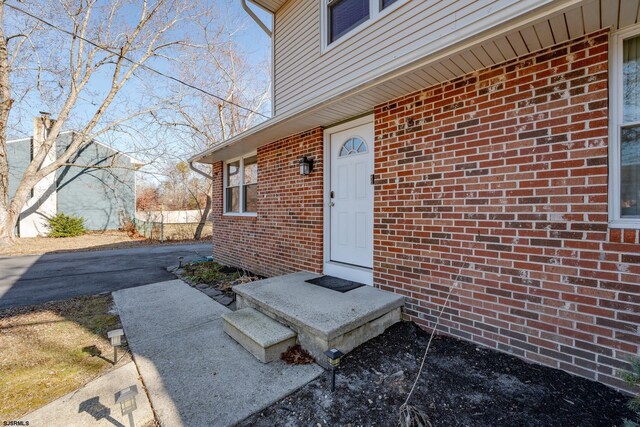 464 S Ash Ave, Galloway Township, NJ 08205 - doorway to property featuring brick siding