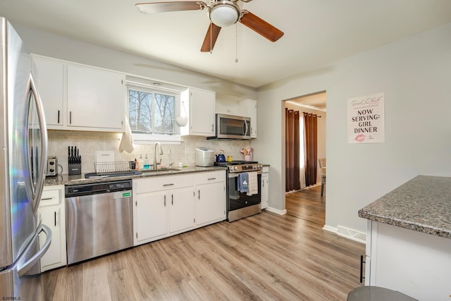 464 S Ash Ave, Galloway Township, NJ 08205 - kitchen with stainless steel appliances, a sink, decorative backsplash, a ceiling fan, and white cabinetry