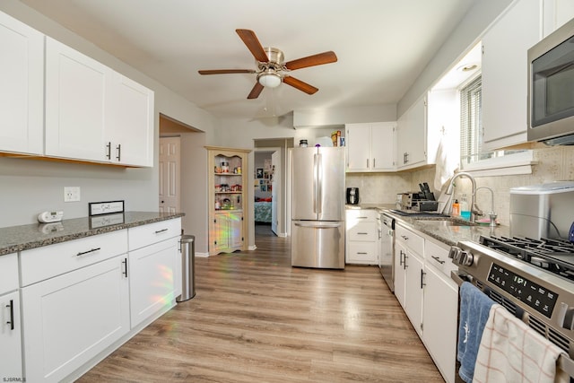464 S Ash Ave, Galloway Township, NJ 08205 - kitchen with appliances with stainless steel finishes, a ceiling fan, stone countertops, light wood finished floors, and white cabinets