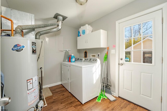 464 S Ash Ave, Galloway Township, NJ 08205 - laundry area with gas water heater, cabinet space, washing machine and clothes dryer, and light wood-style flooring