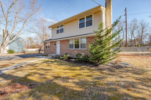 464 S Ash Ave, Galloway Township, NJ 08205 - view of front of home featuring fence, a chimney, and brick siding