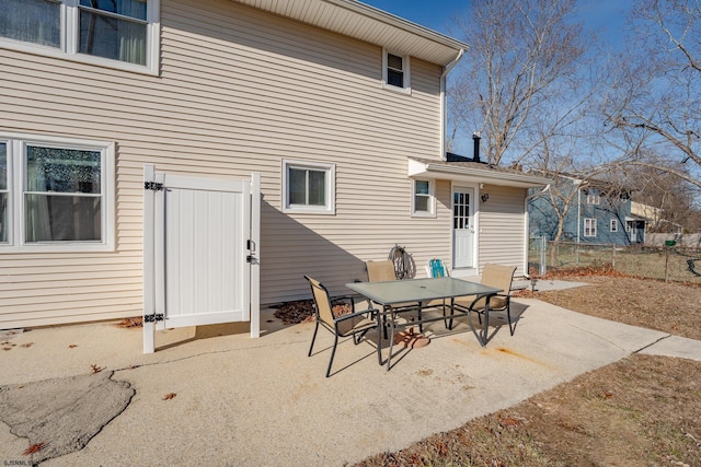 464 S Ash Ave, Galloway Township, NJ 08205 - rear view of house with a patio, fence, and outdoor dining area