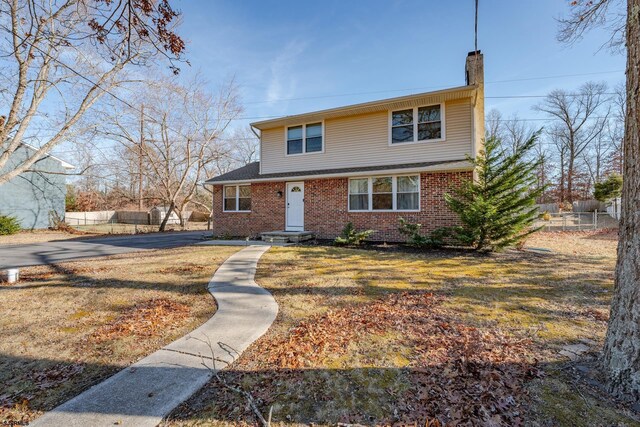 464 S Ash Ave, Galloway Township, NJ 08205 - traditional-style home with a chimney and brick siding