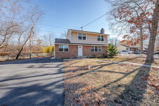 464 S Ash Ave, Galloway Township, NJ 08205 - view of front of home featuring a chimney, brick siding, fence, and driveway