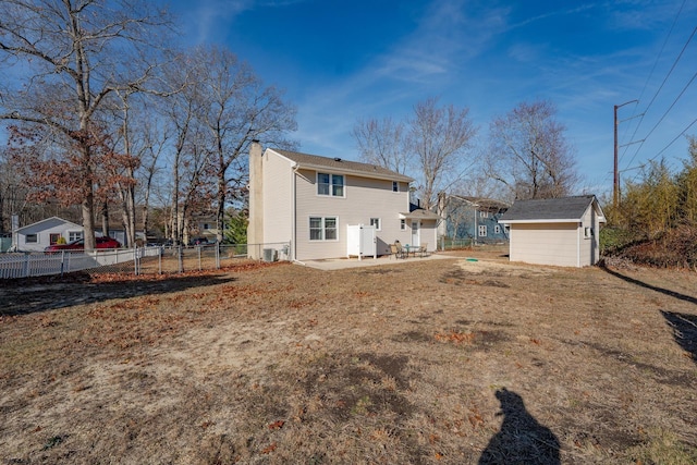 464 S Ash Ave, Galloway Township, NJ 08205 - back of house featuring a chimney, an outdoor structure, a patio, a storage shed, and fence