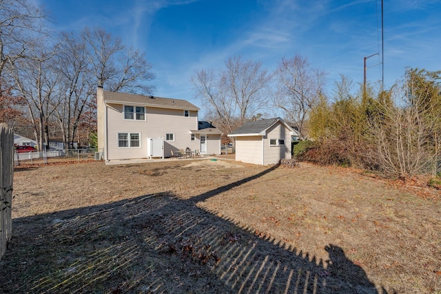 464 S Ash Ave, Galloway Township, NJ 08205 - back of property featuring an outdoor structure, fence, a storage shed, and a chimney