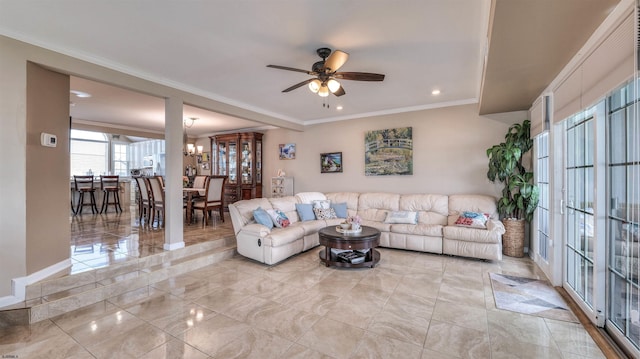 living area featuring a ceiling fan, recessed lighting, ornamental molding, a chandelier, and baseboards