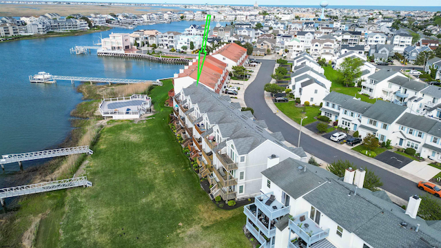 aerial perspective of suburban area with a large body of water
