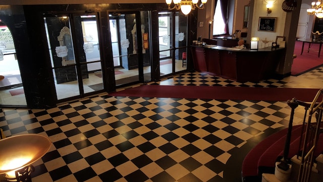 welcome area featuring a chandelier