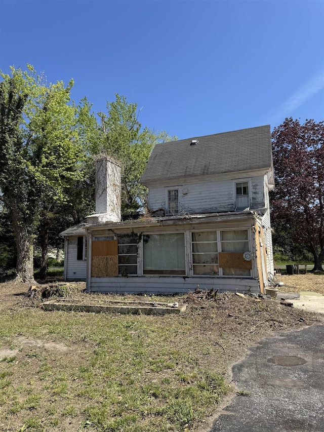 1653 Somers Point Rd, Egg Harbor Township, NJ 08234 - rear view of house featuring a chimney and a sunroom
