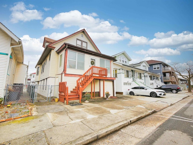 14 N Hillside Ave, Ventnor, NJ 08406 - townhome / multi-family property with a gate, a residential view, stairs, fence, and a garage
