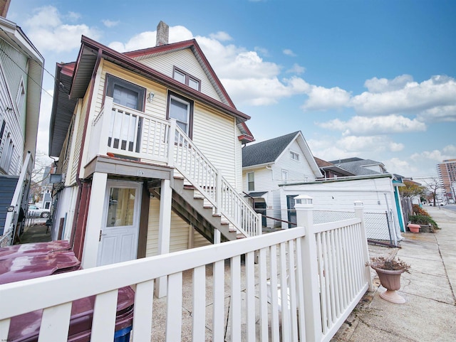 14 N Hillside Ave, Ventnor, NJ 08406 - view of front of property with fence, stairs, and a chimney