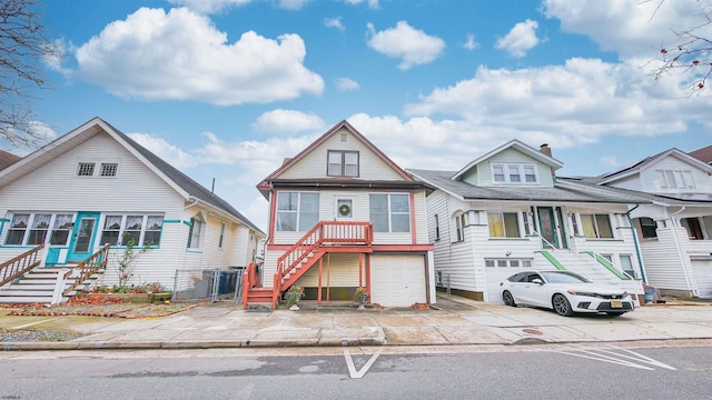 14 N Hillside Ave, Ventnor, NJ 08406 - view of front of home with stairway, a chimney, concrete driveway, and a garage