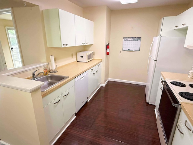 550 Central Avenue G-14Constitution Ct, Linwood, NJ 08221 - kitchen featuring a sink, white appliances, dark wood-style flooring, light countertops, and white cabinets