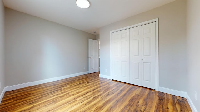 928 S Mill, Vineland, NJ 08360 - unfurnished bedroom with baseboards, wood finished floors, and a closet