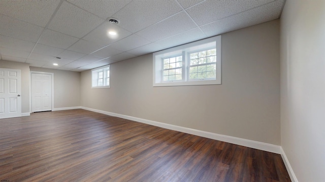 928 S Mill, Vineland, NJ 08360 - basement featuring dark wood-style flooring, baseboards, and a paneled ceiling