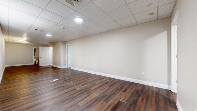 928 S Mill, Vineland, NJ 08360 - empty room with dark wood-style flooring, baseboards, and a drop ceiling