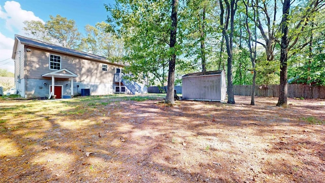 928 S Mill, Vineland, NJ 08360 - view of yard featuring a storage unit, an outdoor structure, fence, and stairs