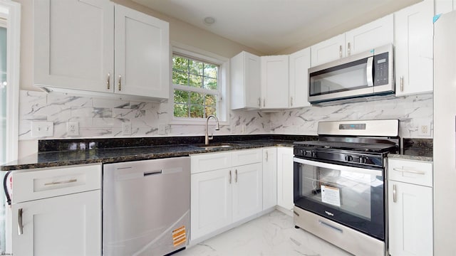 928 S Mill, Vineland, NJ 08360 - kitchen featuring stainless steel appliances, light marble finish floors, white cabinetry, and dark stone countertops