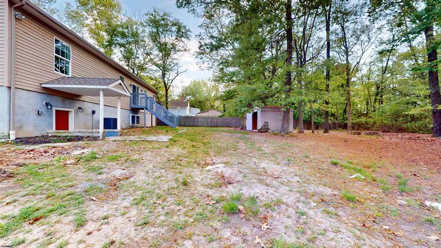 928 S Mill, Vineland, NJ 08360 - view of yard with a storage unit, an outdoor structure, stairs, and fence