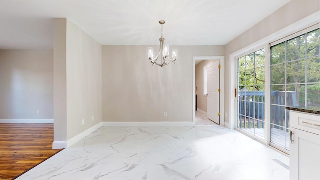 928 S Mill, Vineland, NJ 08360 - unfurnished dining area with baseboards, a chandelier, and marble finish flooring
