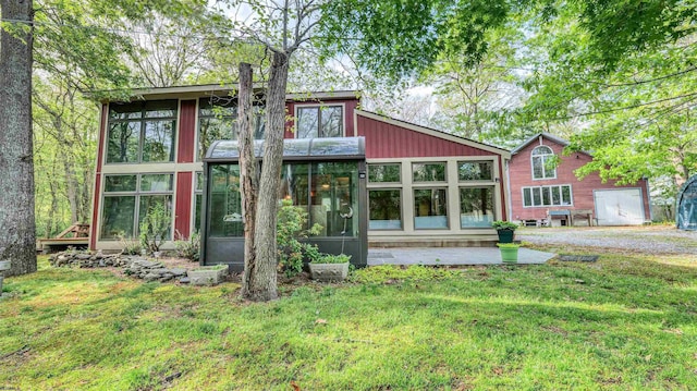 515 E Brook Ln, Galloway Township, NJ 08205 - rear view of property featuring a sunroom and a yard