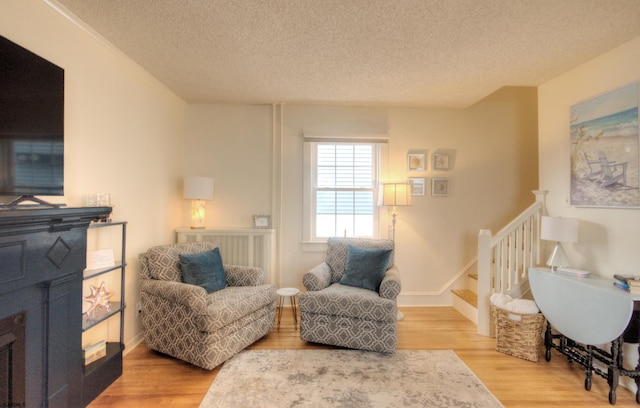 15 N Douglas Ave, Margate, NJ 08402 - living area with wood finished floors, a textured ceiling, and stairway