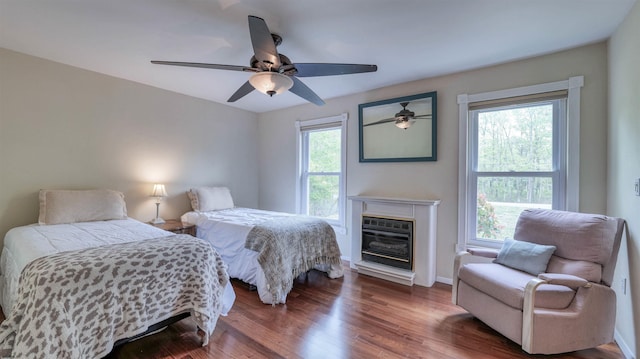 31 English Ln, Egg Harbor Township, NJ 08234 - bedroom featuring wood finished floors, a ceiling fan, baseboards, and a glass covered fireplace